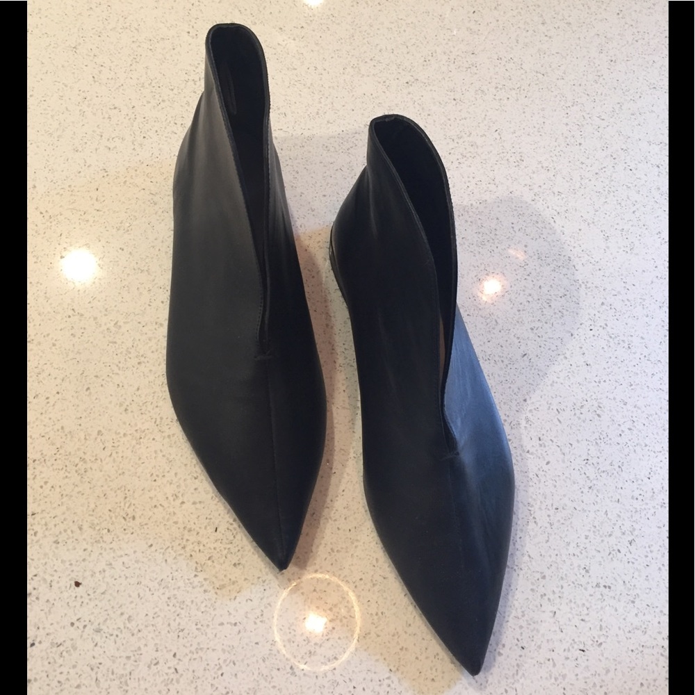 Extra pointy black booties